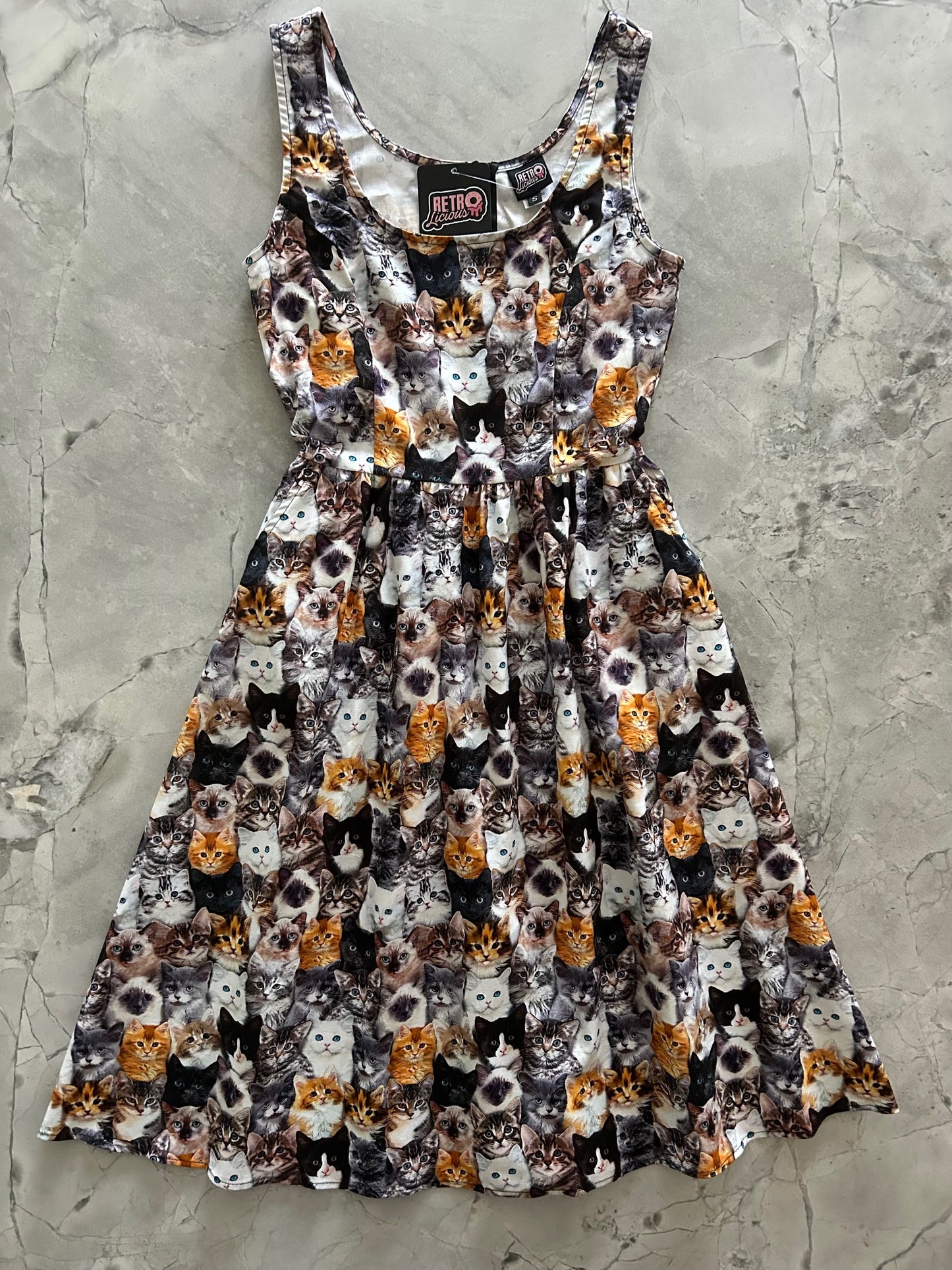 flatlay of realistic cats fit and flare dress