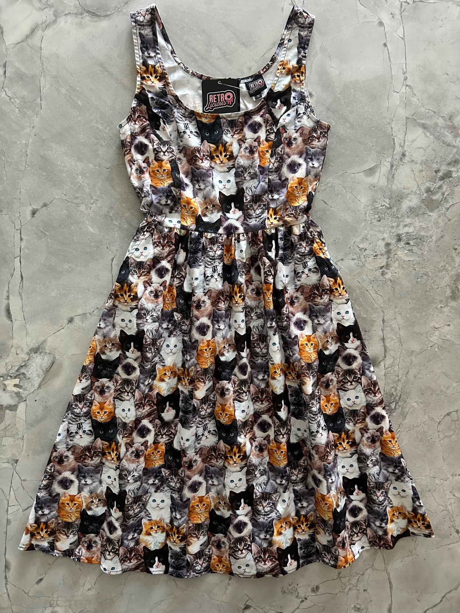 flatlay of realistic cats fit and flare dress