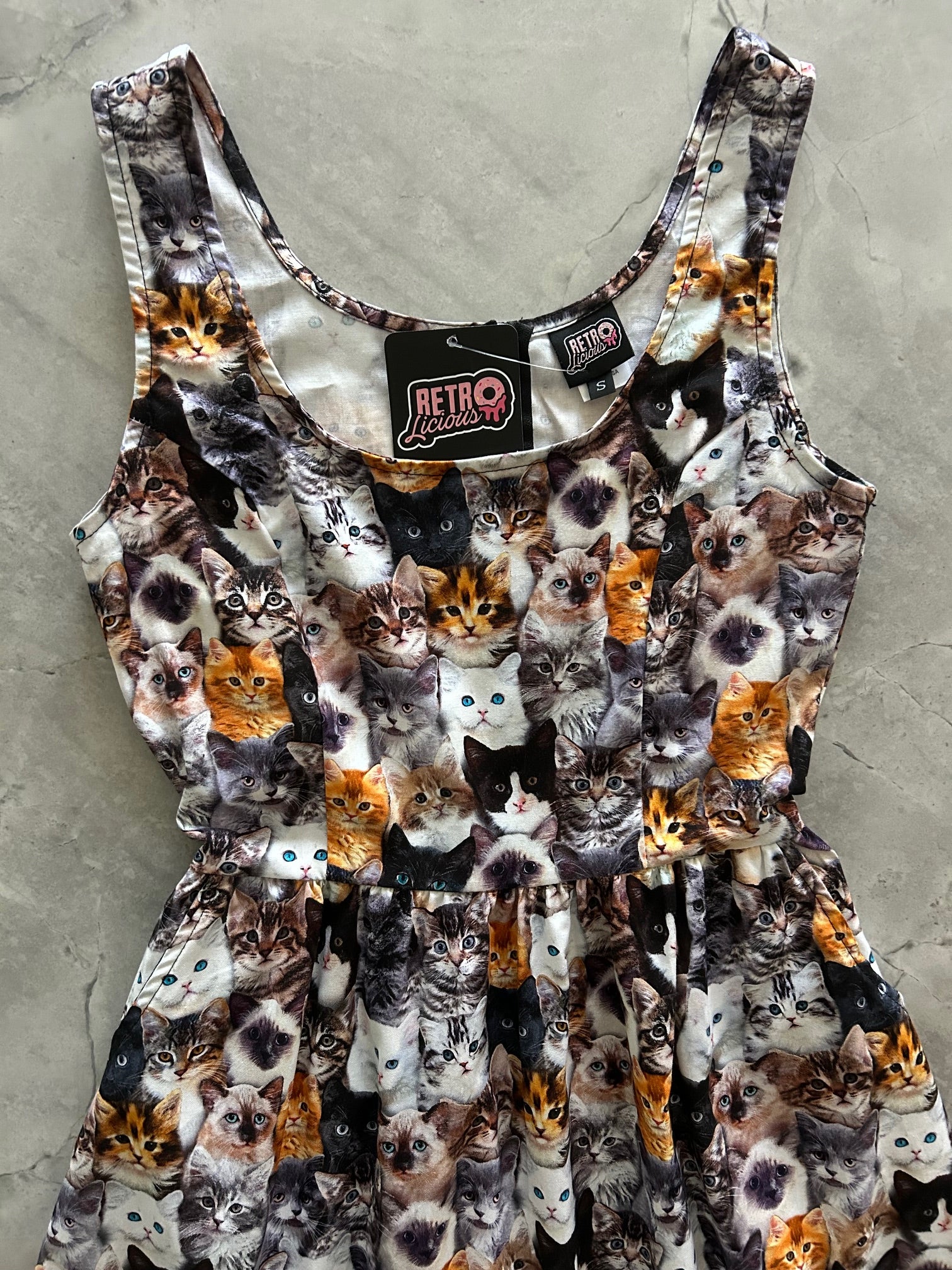 flatlay of close up of bodice of realistic cats fit and flare dress