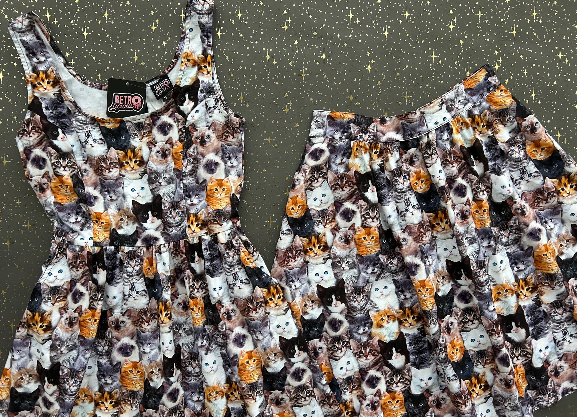 flatlay of realistic cats dress and skir on grey background with stars