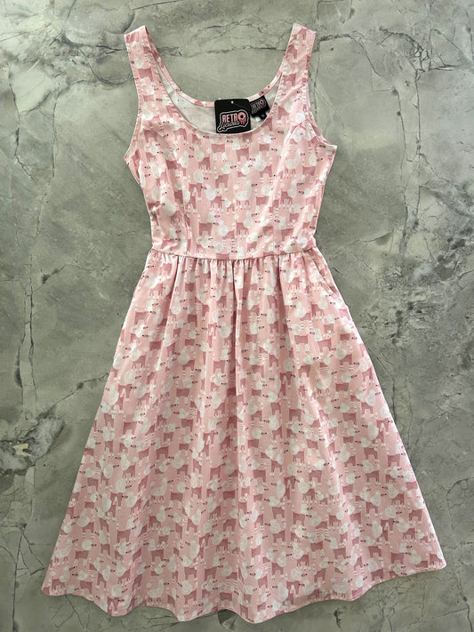 flatlay of pink dress with poodles print