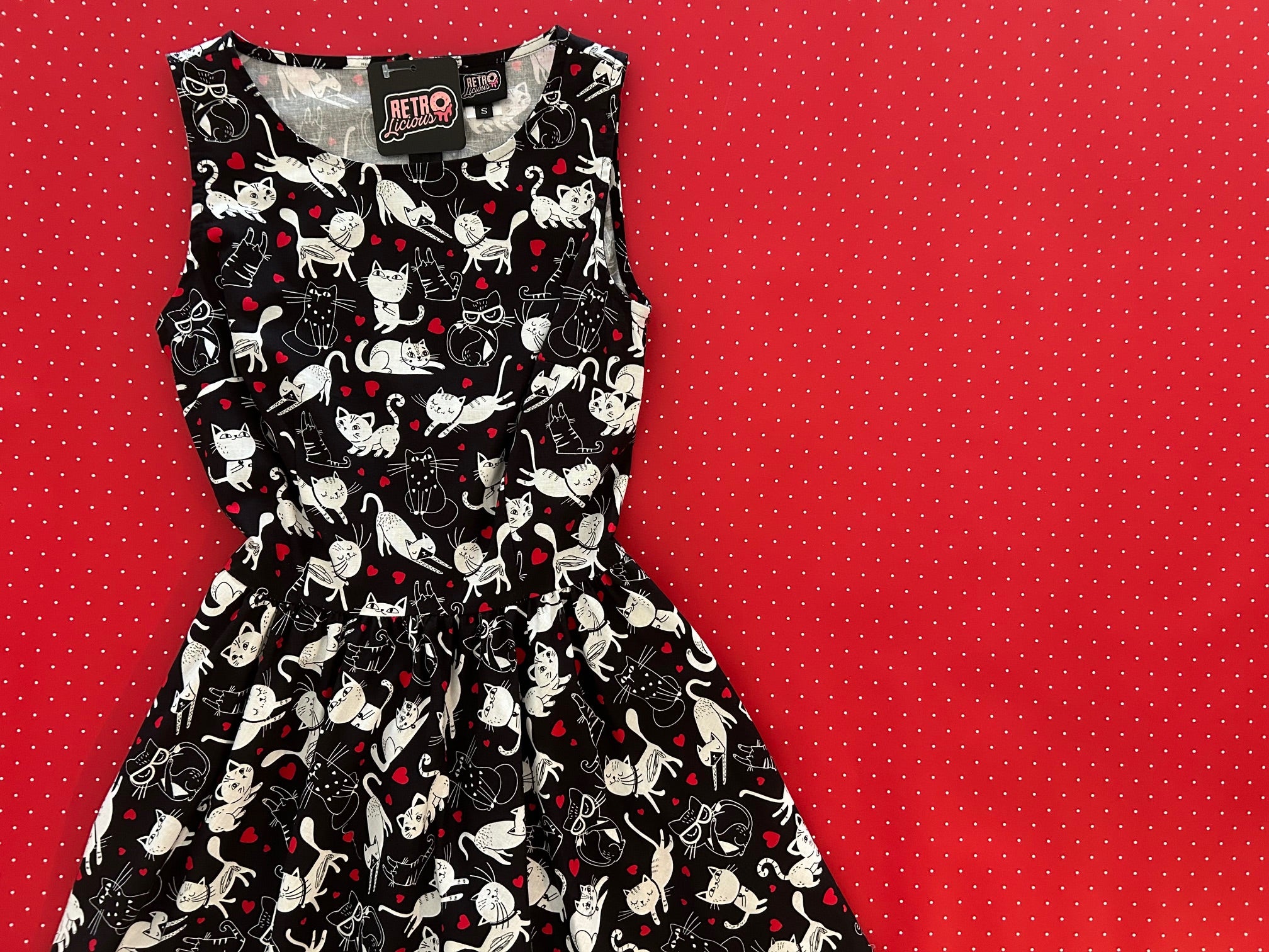 Dress with cat pattern on a red background