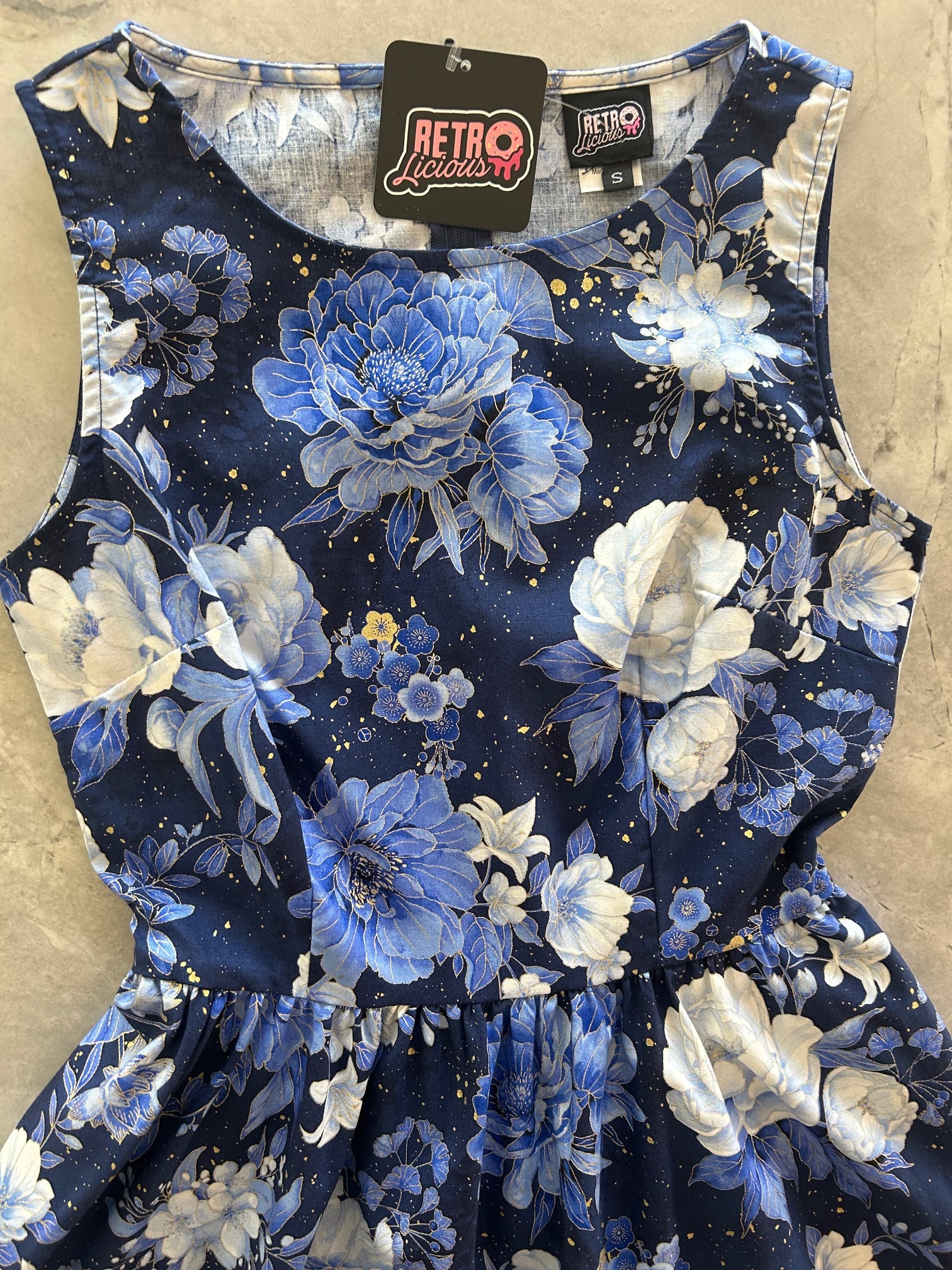 close up of bodice of metallic floral vintage dress