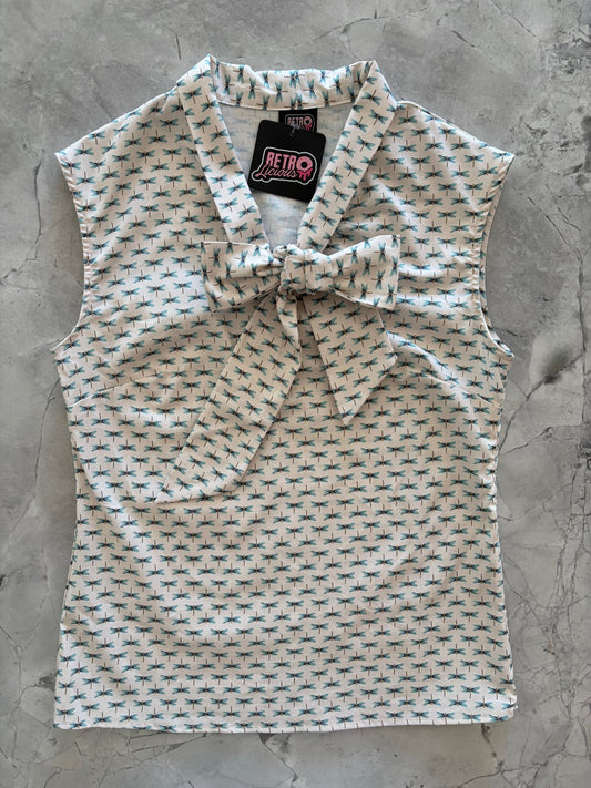flatlay of dragonfly print bow top