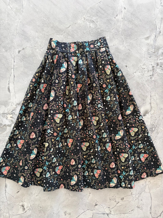 flatlay of doris skirt in moth print