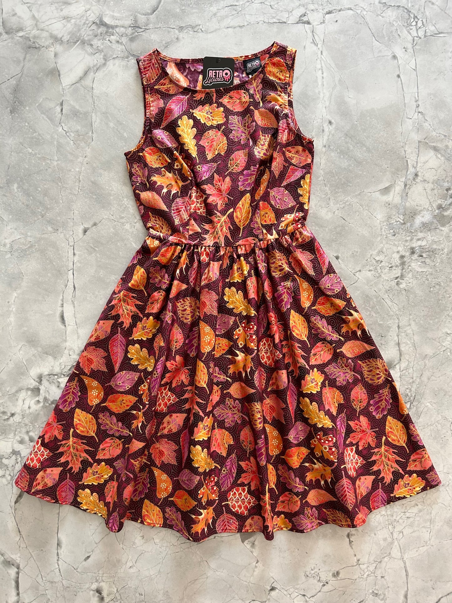a flat lay image of the front of our leaves vintage dress