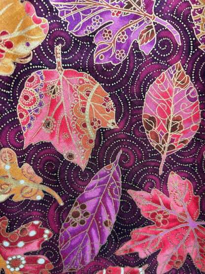 a close up showing the detail of the fabric print on the Fall Vintage Dress with up close fo the leaes with gold detail design