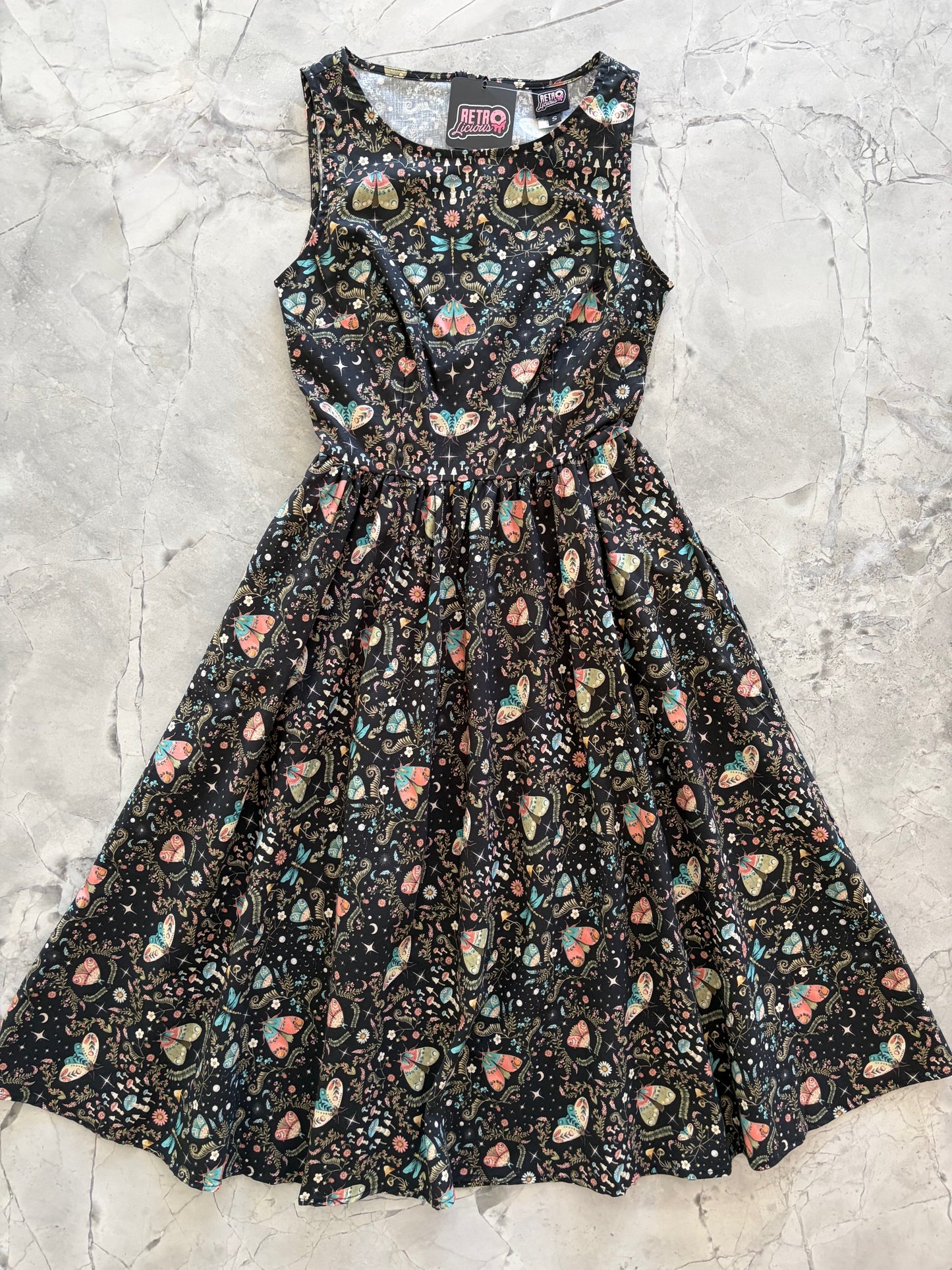 Floral-patterned dress on a textured surface