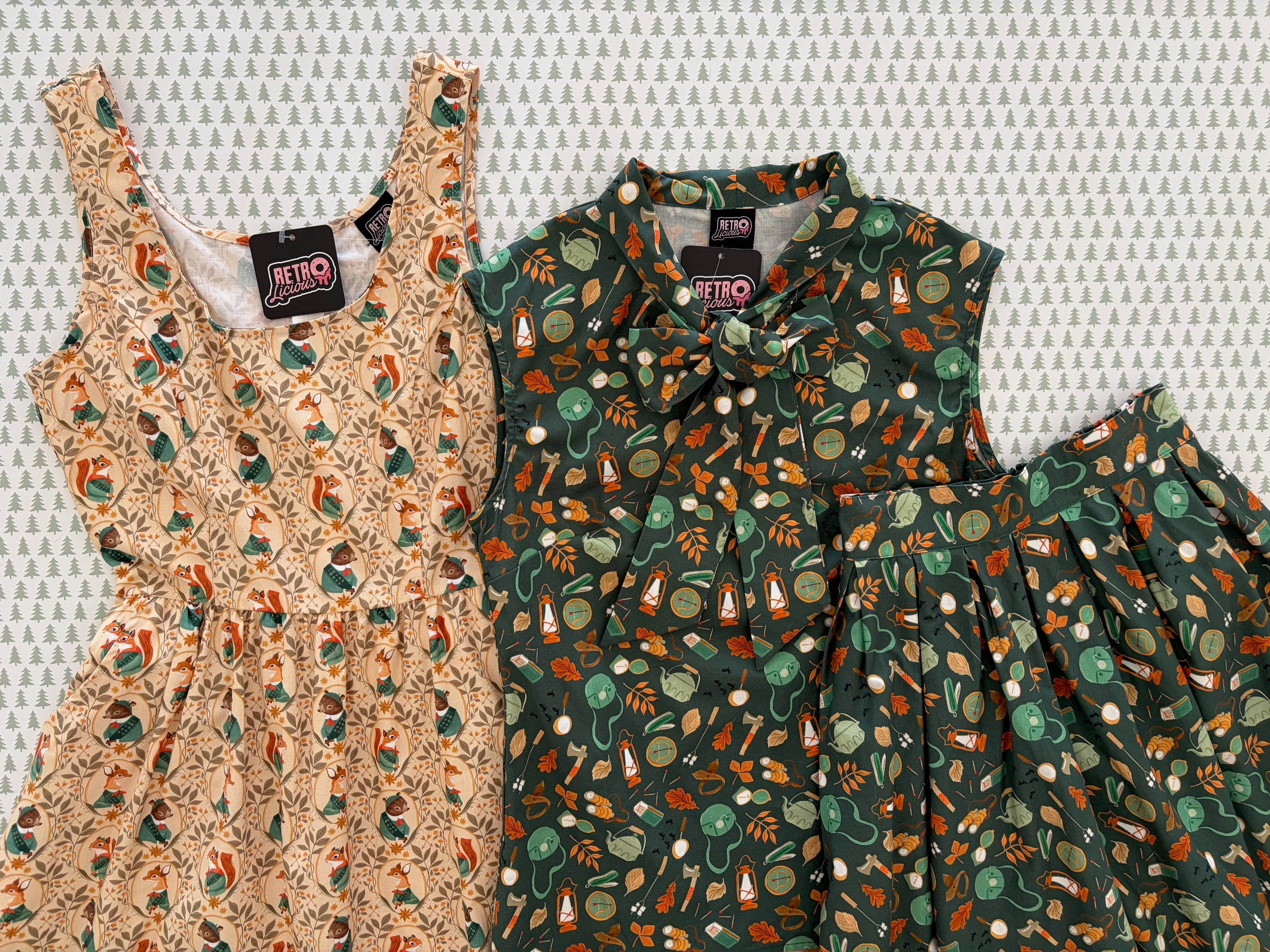 Two patterned dresses on a textured white background