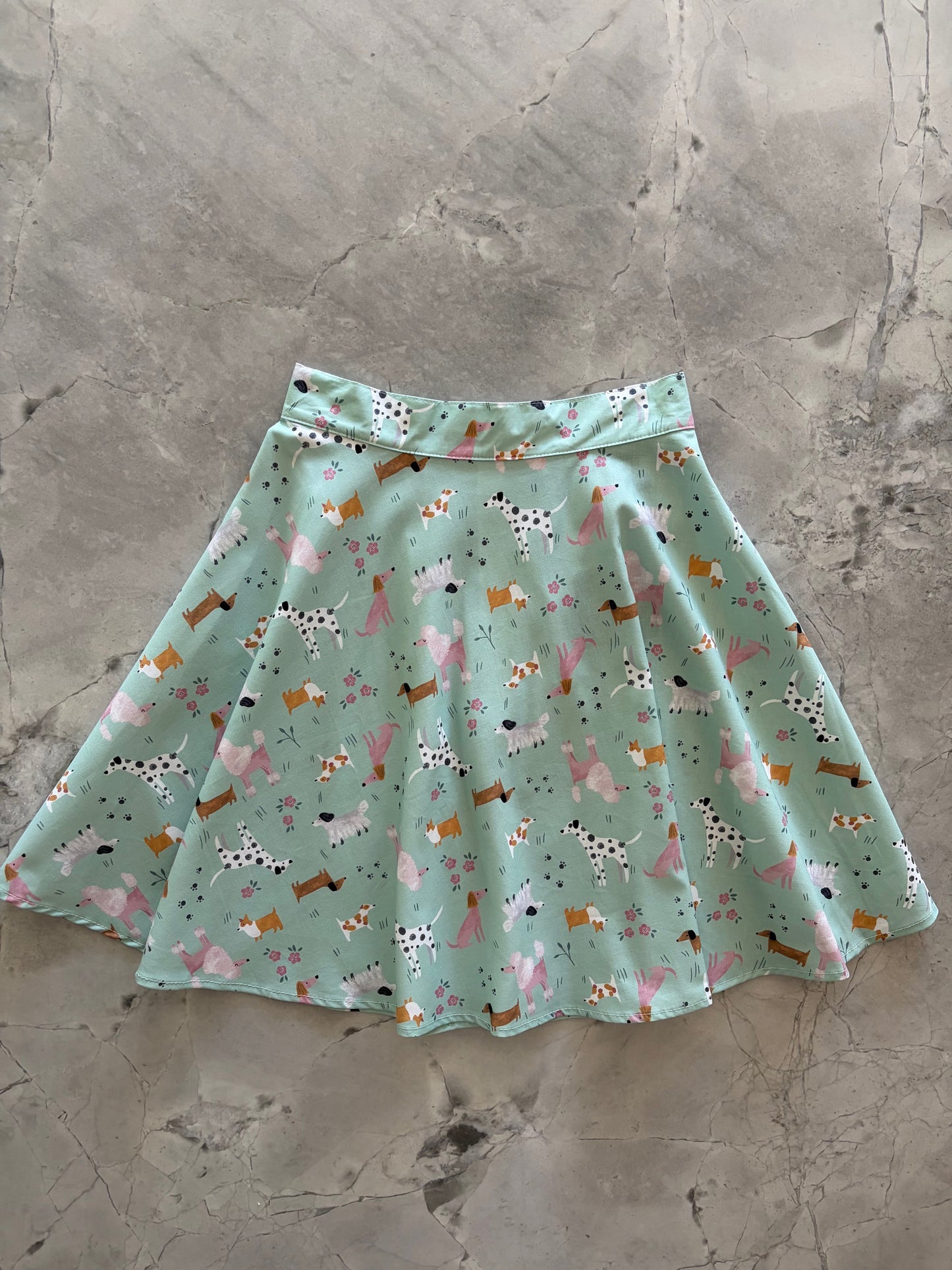 skater skirt with dog pattern on a textured surface