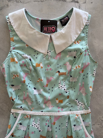 close up of dress with dog pattern on a gray surface