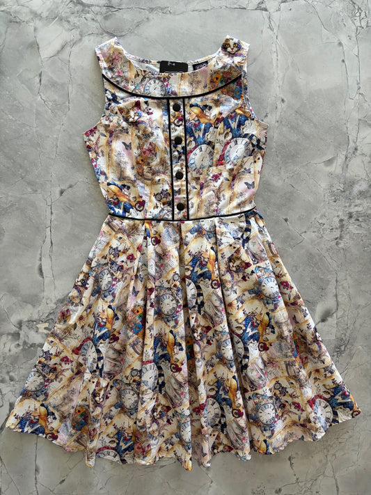 Colorful dress with alice in wonderland on a textured gray surface