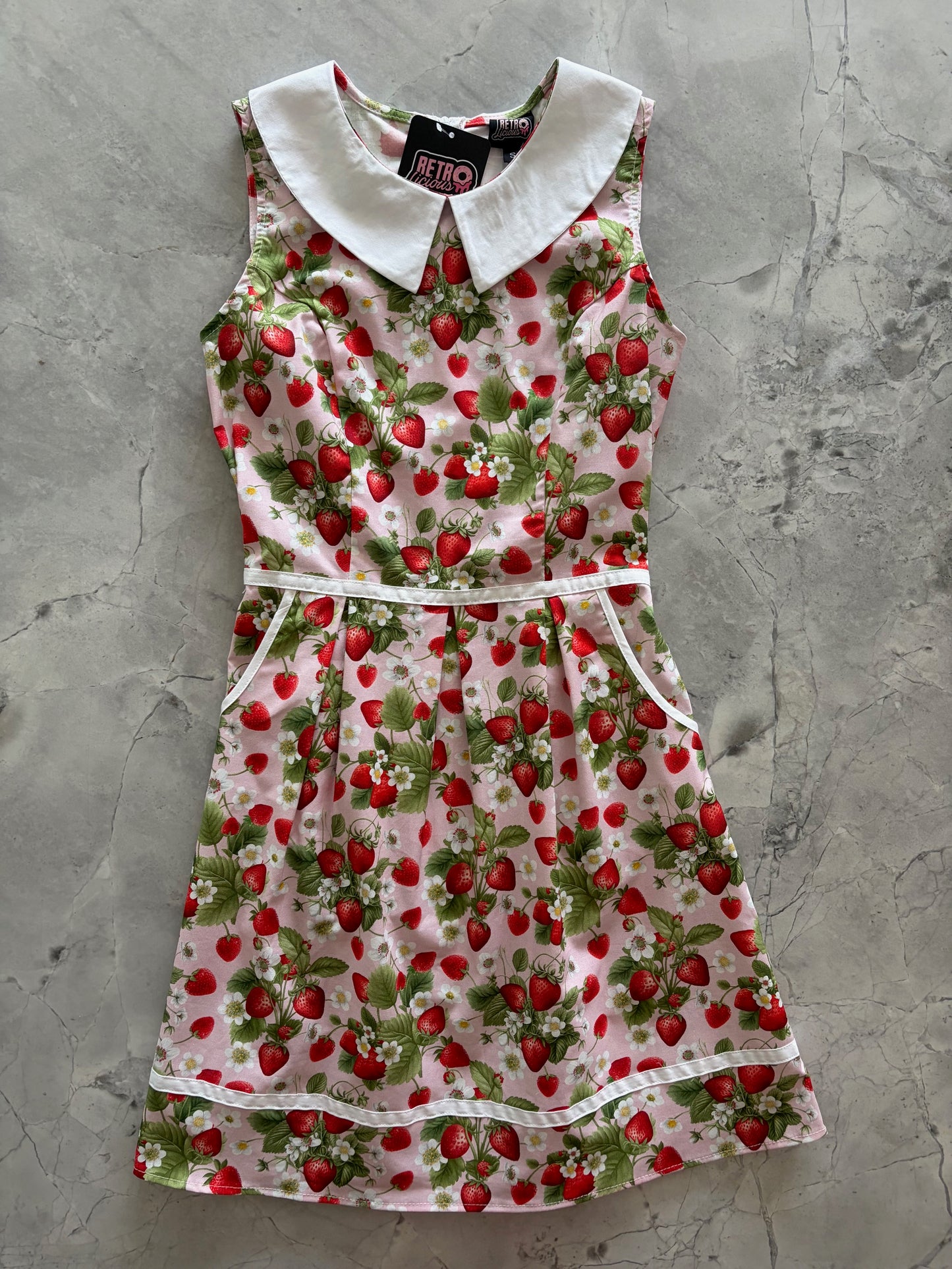 flatlay of strawberry collare dress
