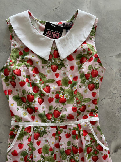 Strawberry-patterned garment on a gray surface