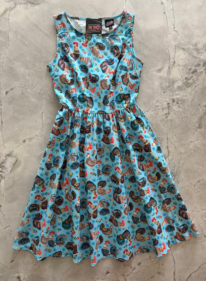 Dress with rooster pattern on a textured surface