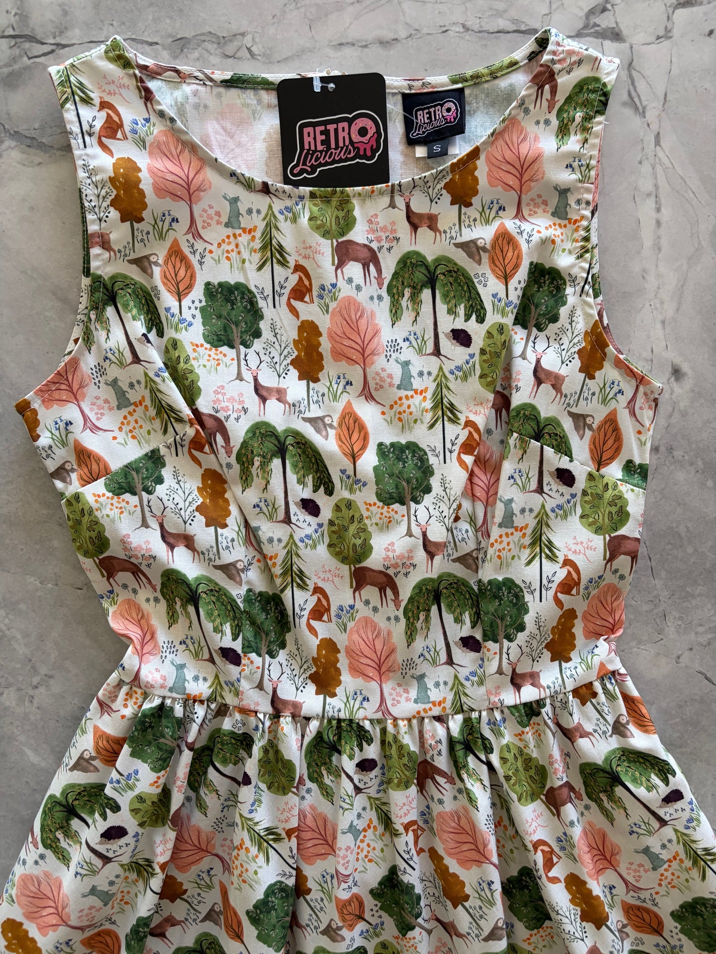 animal-patterned fabric with a brand label on a concrete surface