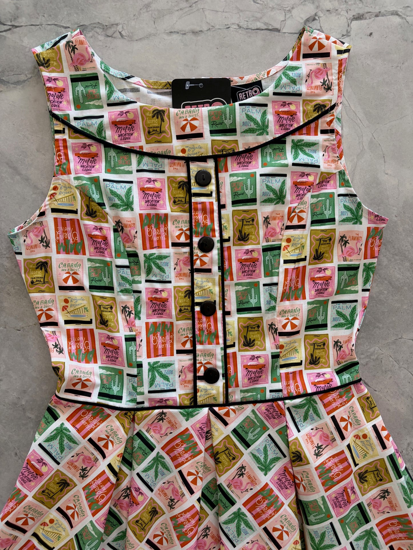 Patterned fabric with a grid of colorful squares on a gray surface