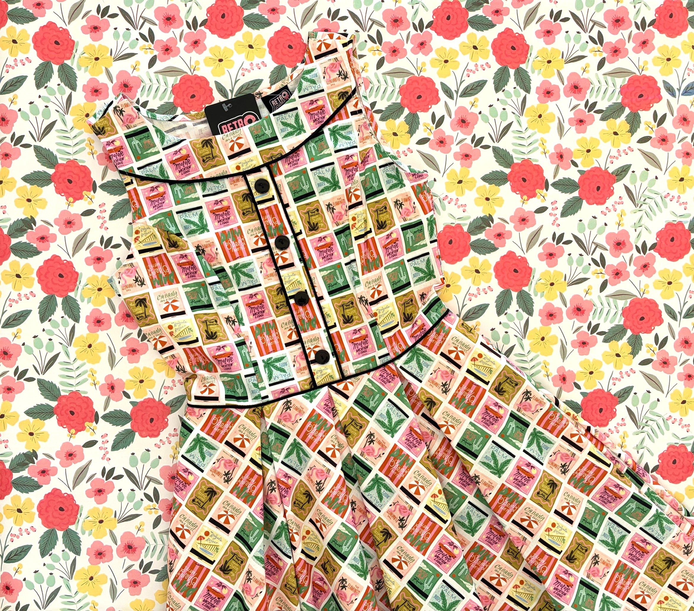 Floral patterned fabric with a matching dress on a floral background