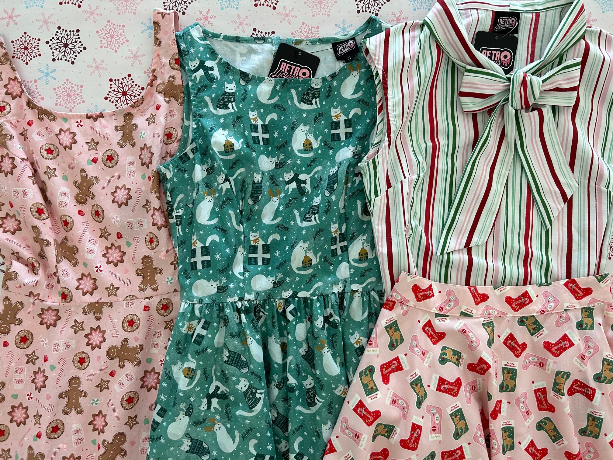 holiday dresss, skirtsa and tops with cats, stockings and other holiday motifs