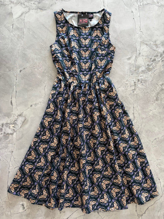 Butterfly patterned dress on a textured gray background