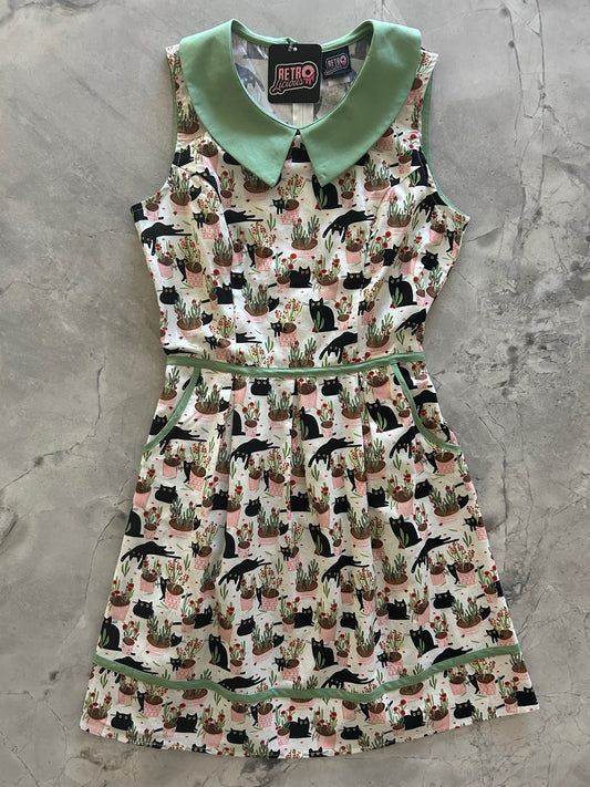 flatlay of cats and plants collared dress