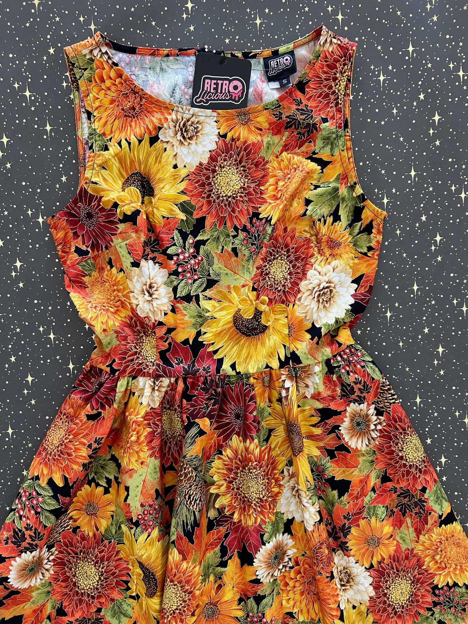 flatlay of our fall vintage dress on grey background with stars