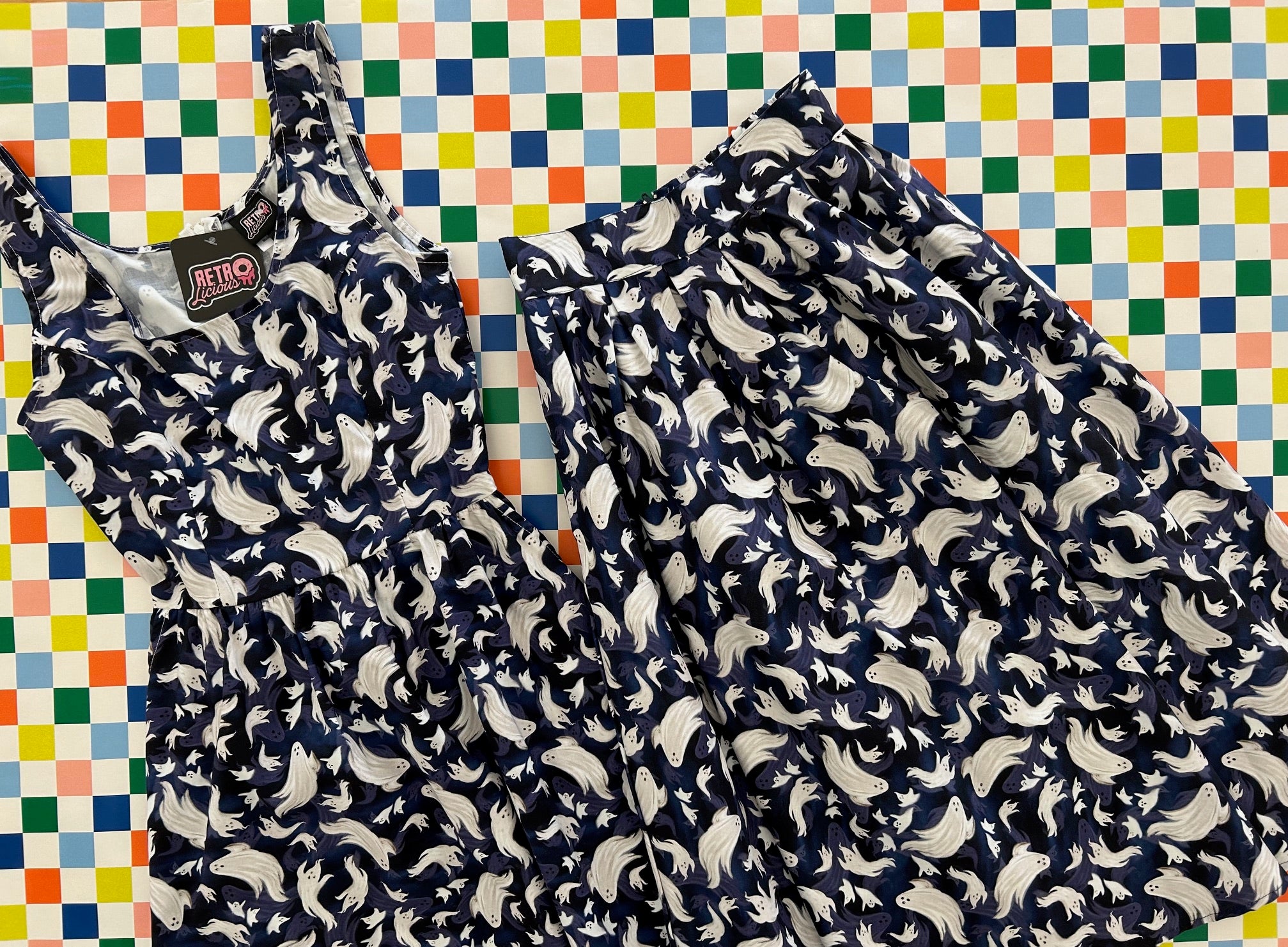 flatlay of flying ghosts dress and doris skirt on a checkered background