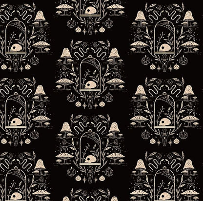 a close up of the fabric of Apothecary dress showing the skull and mushroom and snake design