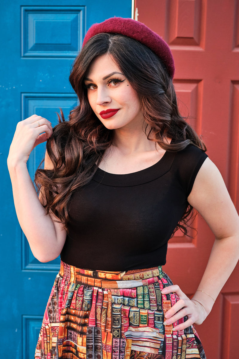 a close up image of a model wearing our Don't Judge a Book by its Cover Skirt