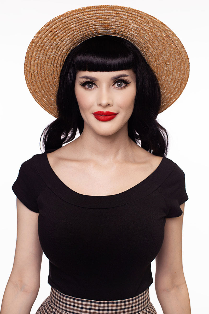 Model wearing black vintage top facing forward