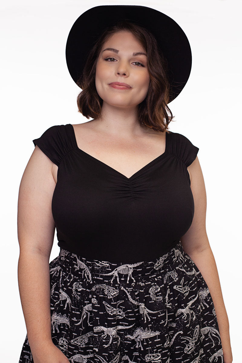 Plus size model wearing Isabel top in black