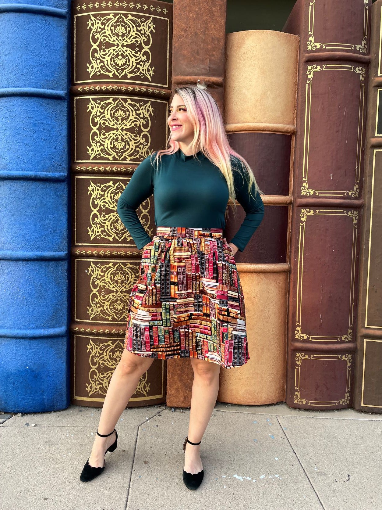a full length of a model wearing our green mock neck top