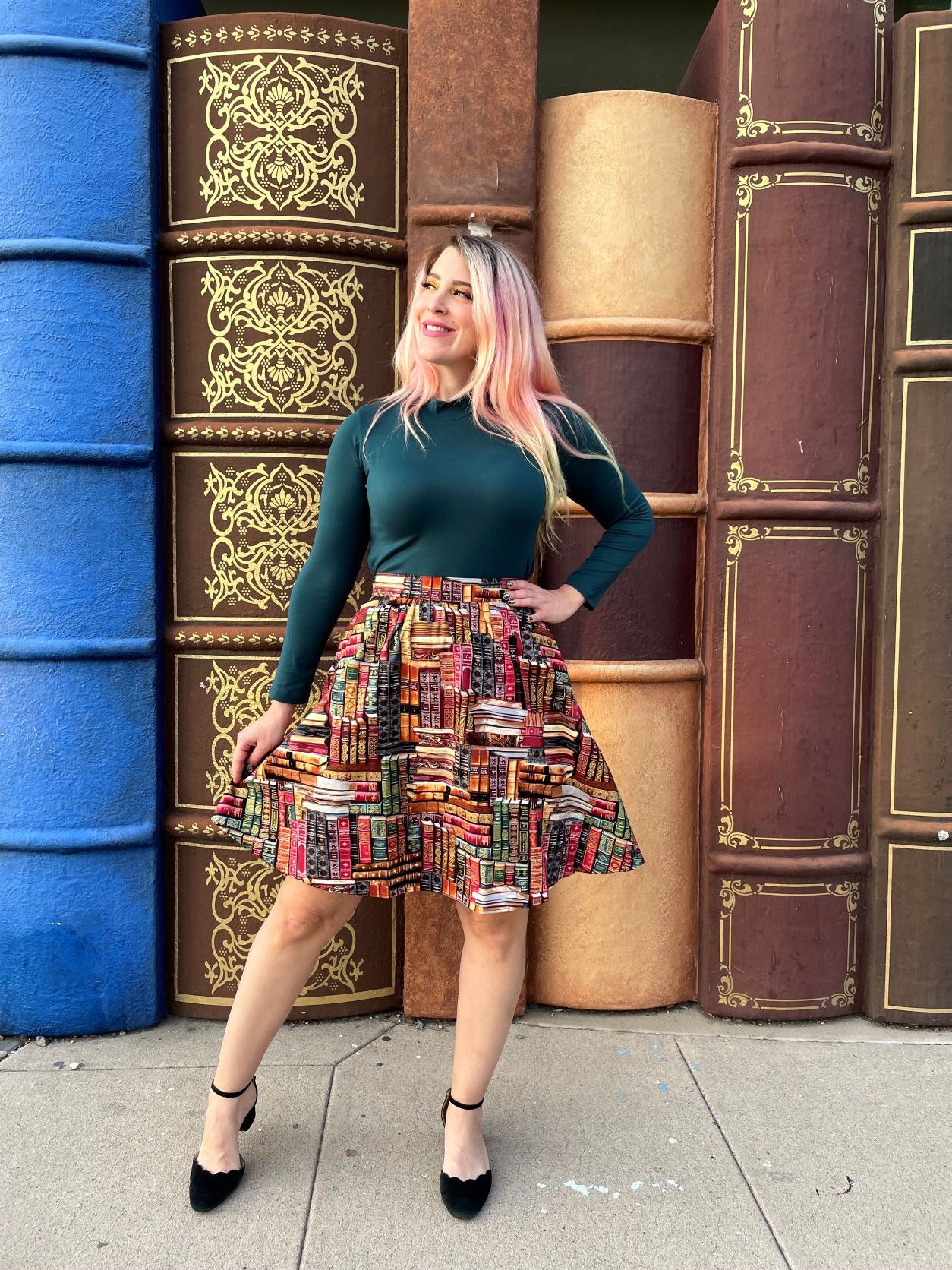 a full length of a model wearing our green mock neck top