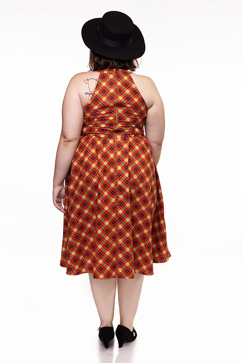 a back side of a plus size  model wearing our Plaid High Neck dress
