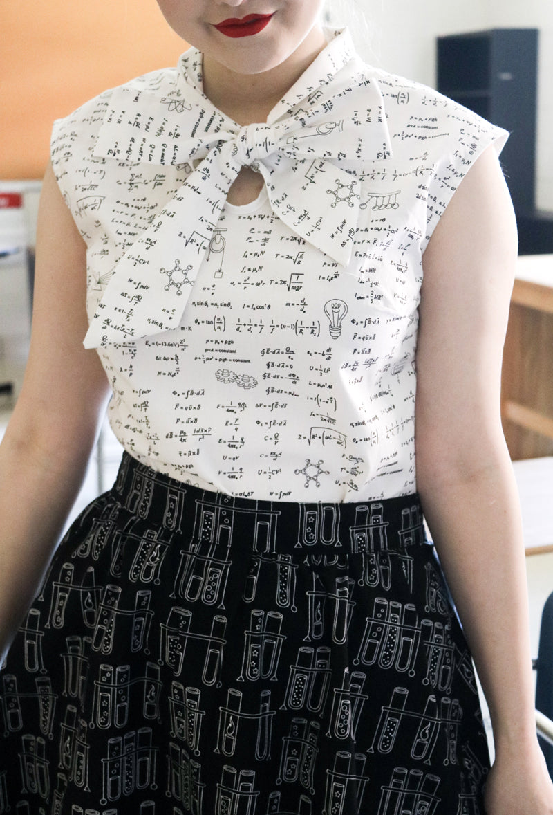 close up of model wearing our equations bow top