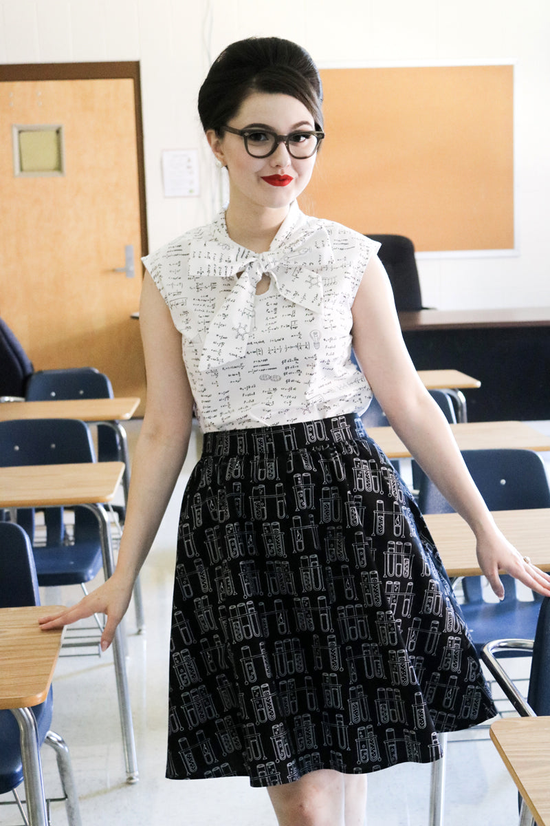 model wearing our equations bow top in a classroom