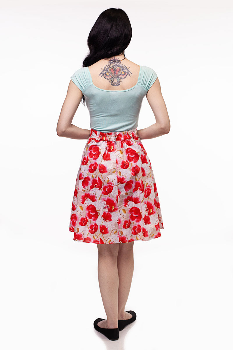 full size image of a back of a model wearing our pink floral a-line skirt
