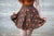 Shot of skater skirt in brown.