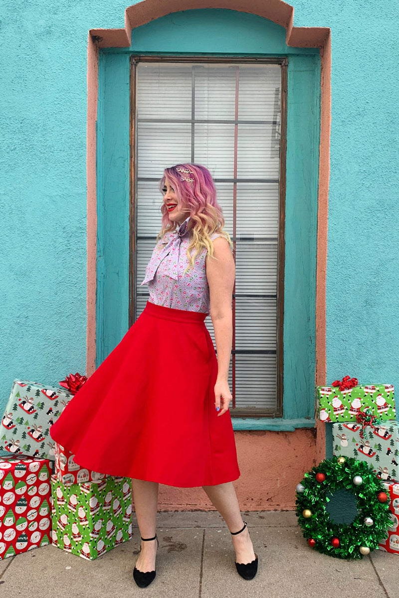 a model wearing the charlotte skirt in red
