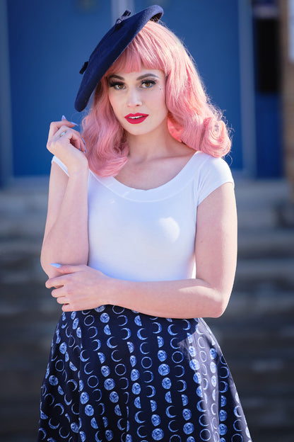a model standing in front of stairs wearing lets phase it skater skirt