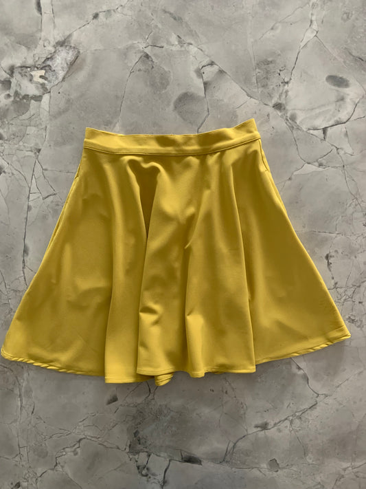 a flat lay of the chartreuse skater skirt