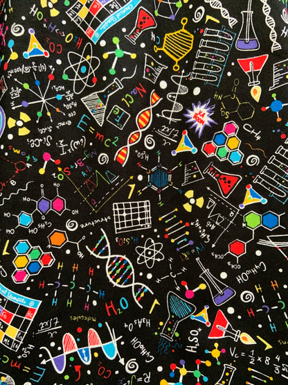 a close up of the fabric of our science a-line skirt showing the colorful science images of molecules, flasks and formulas