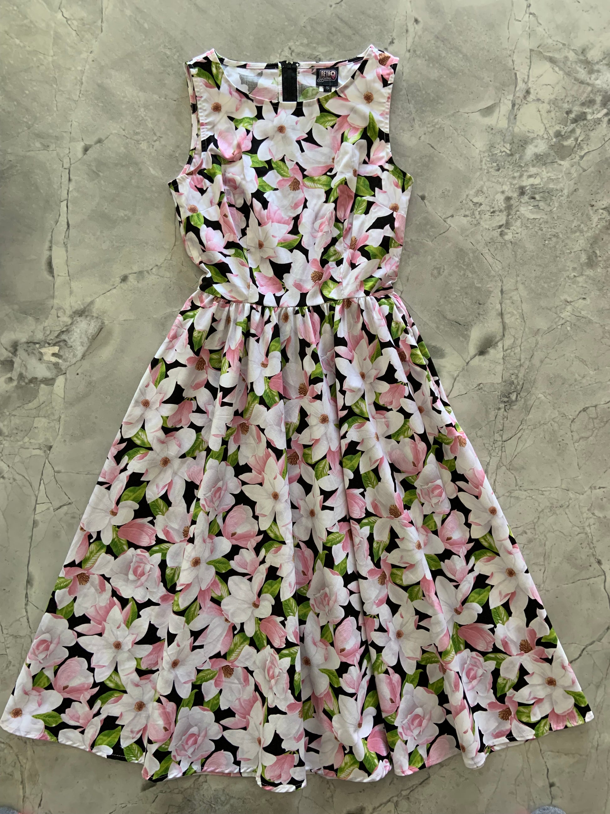 a flat lay of magnolia midi dress