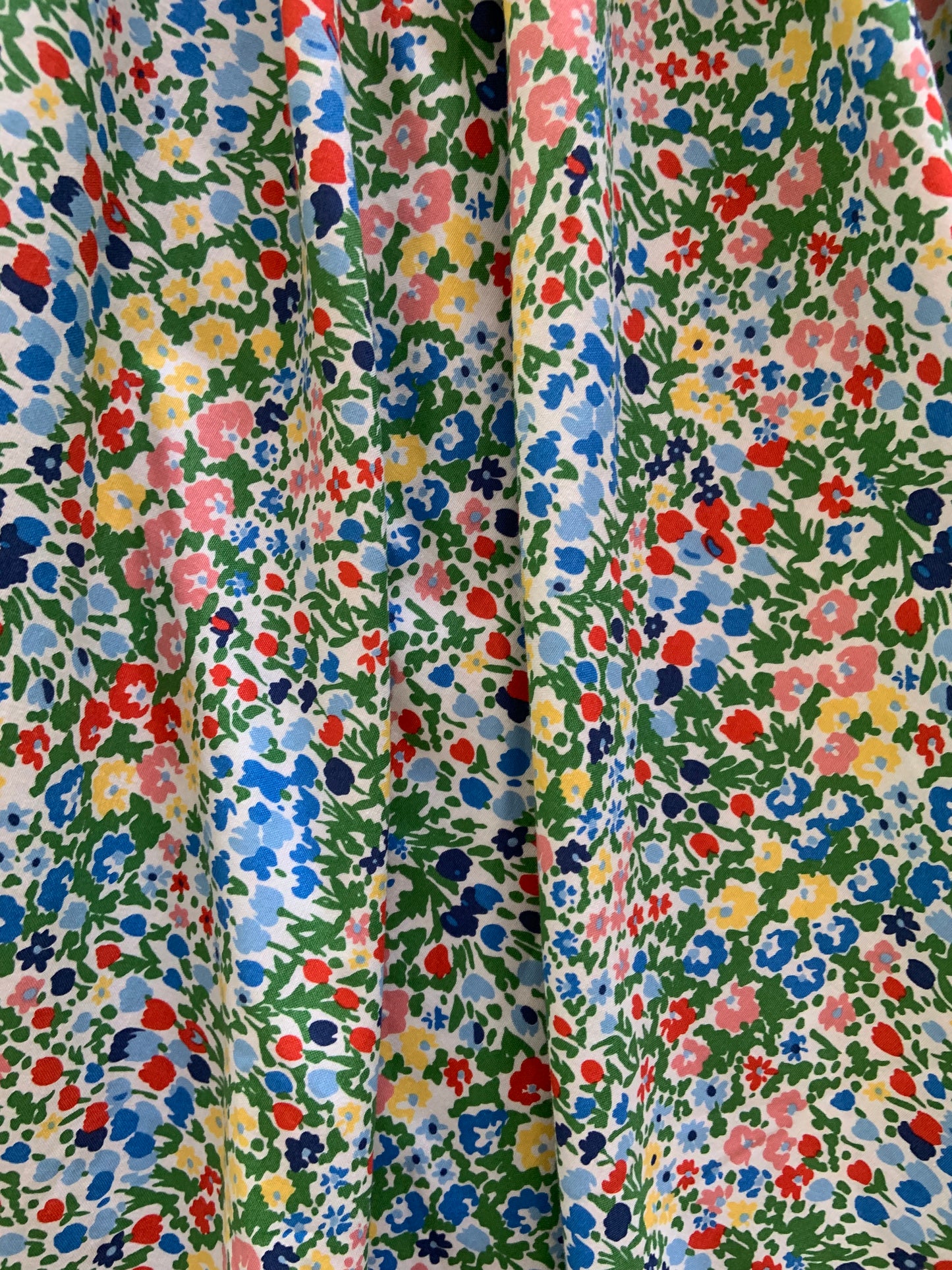 a close up of fabric of the painted floral midi dress