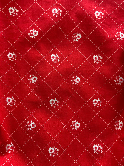 a close up of the fabric for the red floral vintage dress