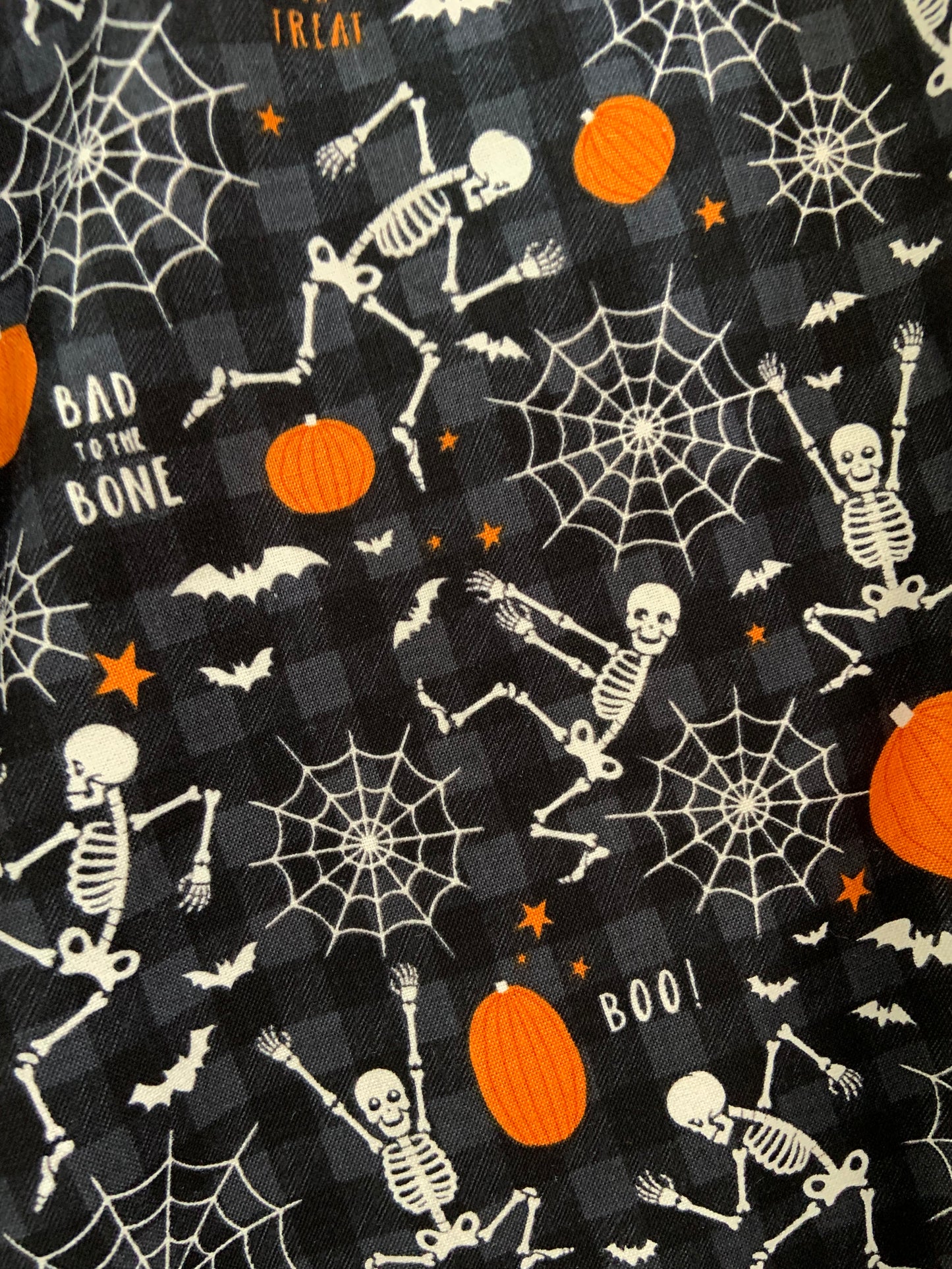 a swatch of the glow in the dark dancing skeletons skater skirt