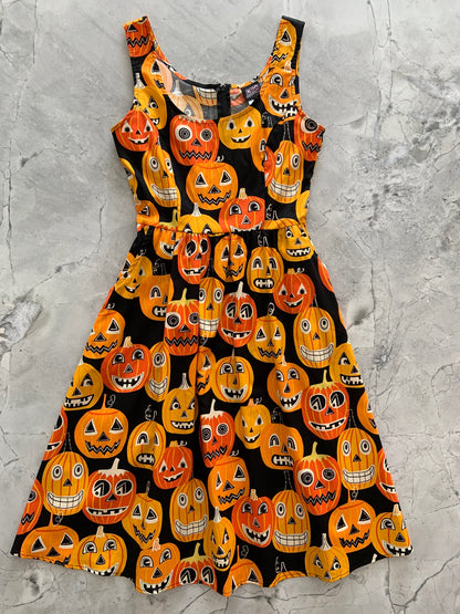 a flat lay of the front of our jack-o-lanterns fit and flare dress