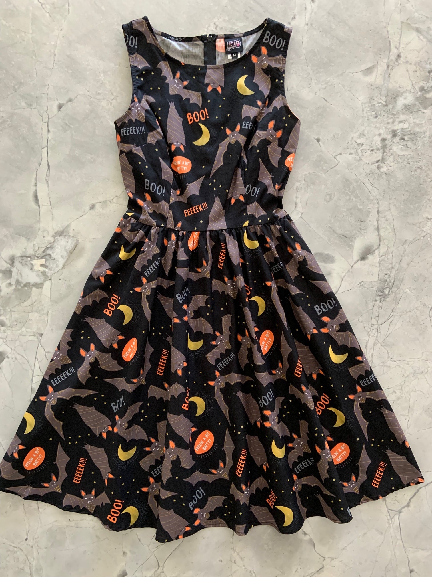 a flat lay of the front of our Feelin Batty dress