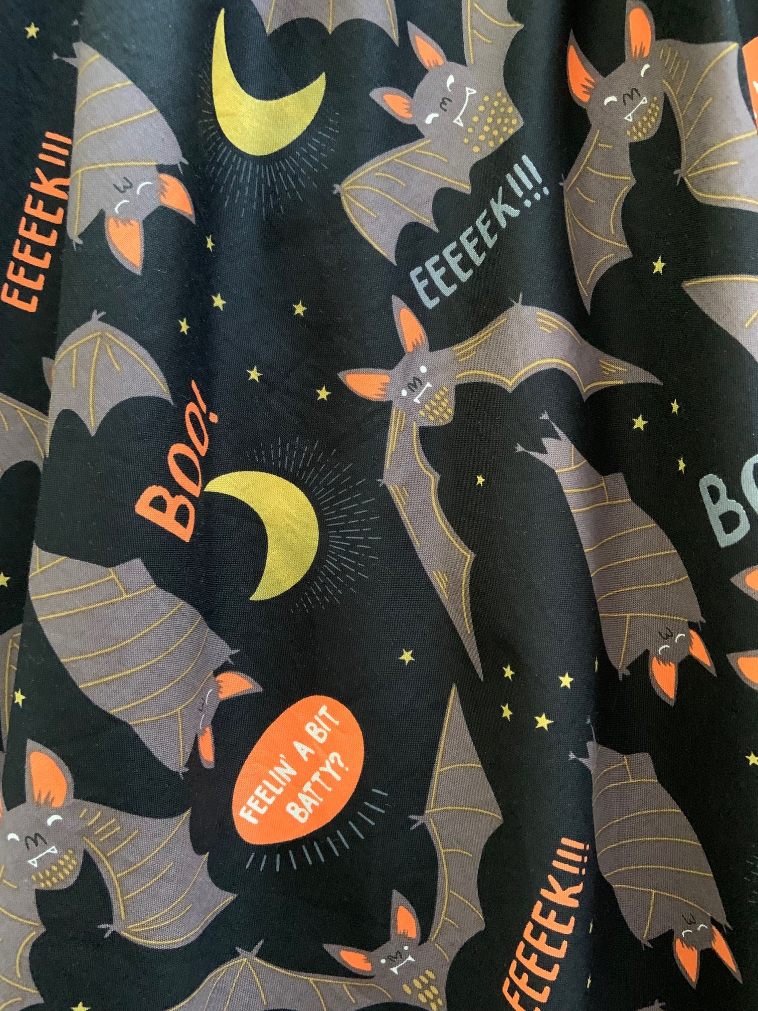 a close up of the fabric of the feelin batty vintage dress