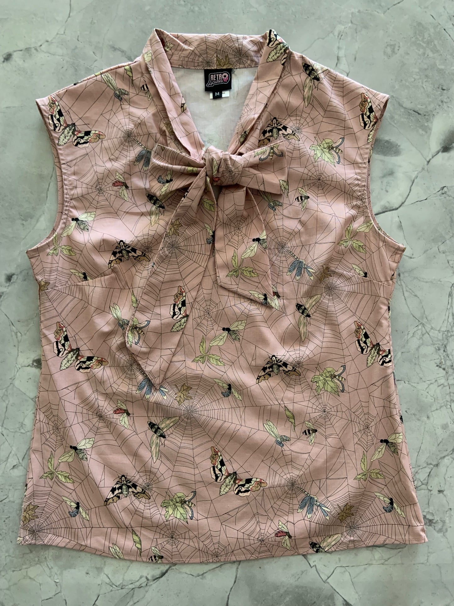 a flat lay image of the front of our moth bow top